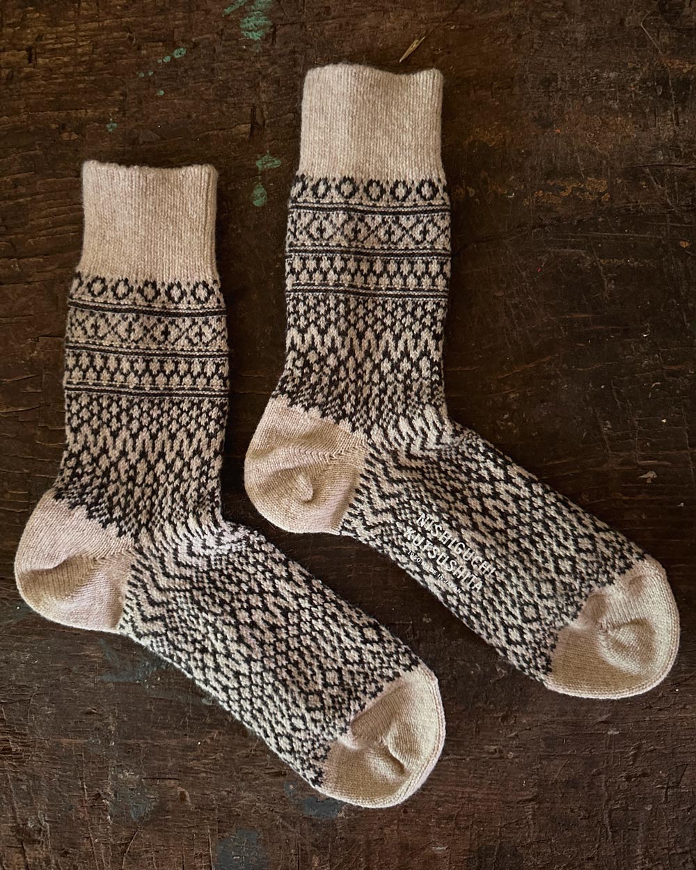 Wool Jacquard Socks in Oatmeal on wooden table