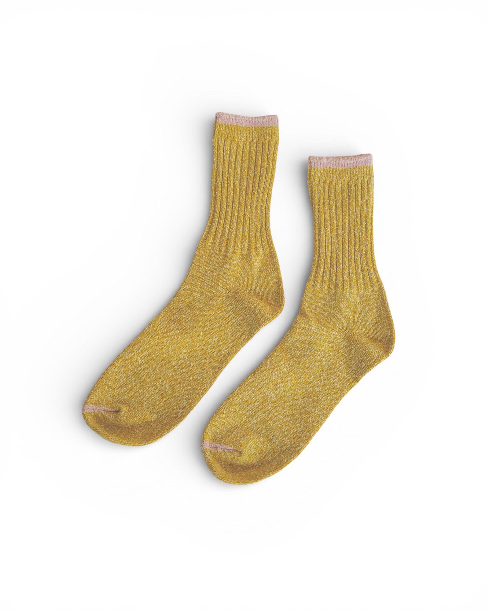 A pair of Silk Cotton Socks in Yellow by Pyne and Smith Clothiers, featuring ribbed recycled cotton and light pink trim at the cuffs, displayed side by side on a white background.