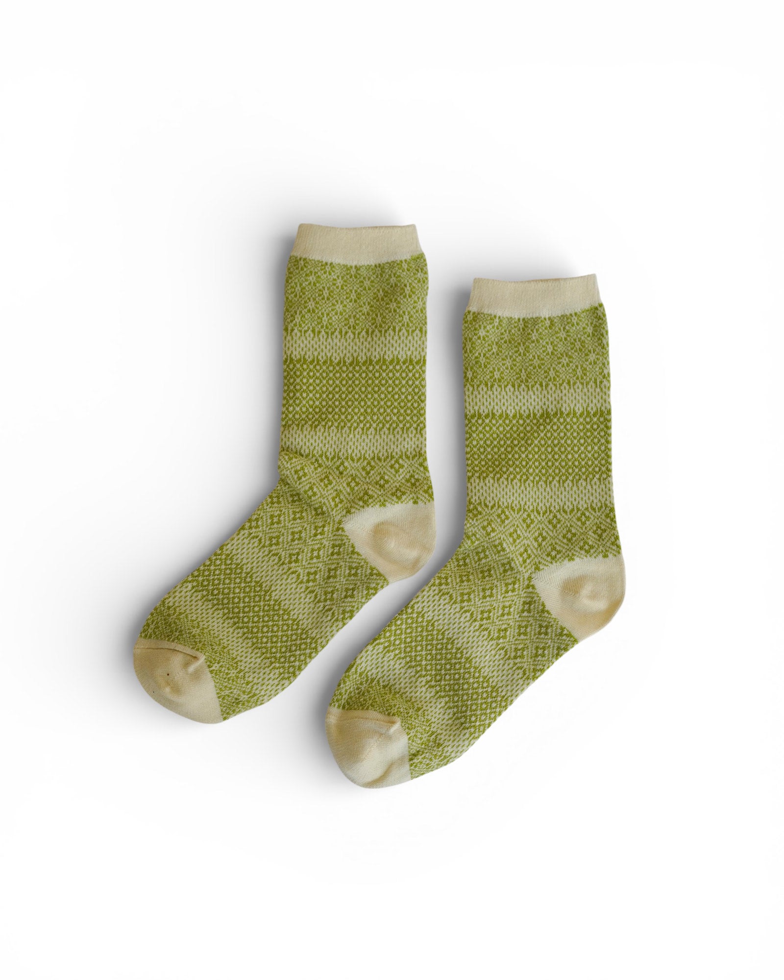 A pair of Pyne and Smith Clothiers Cotton Linen Jacquard Socks in Dappled Sunlight, featuring a green pattern with cream toes, heels, and cuffs, are displayed side by side on a white background.