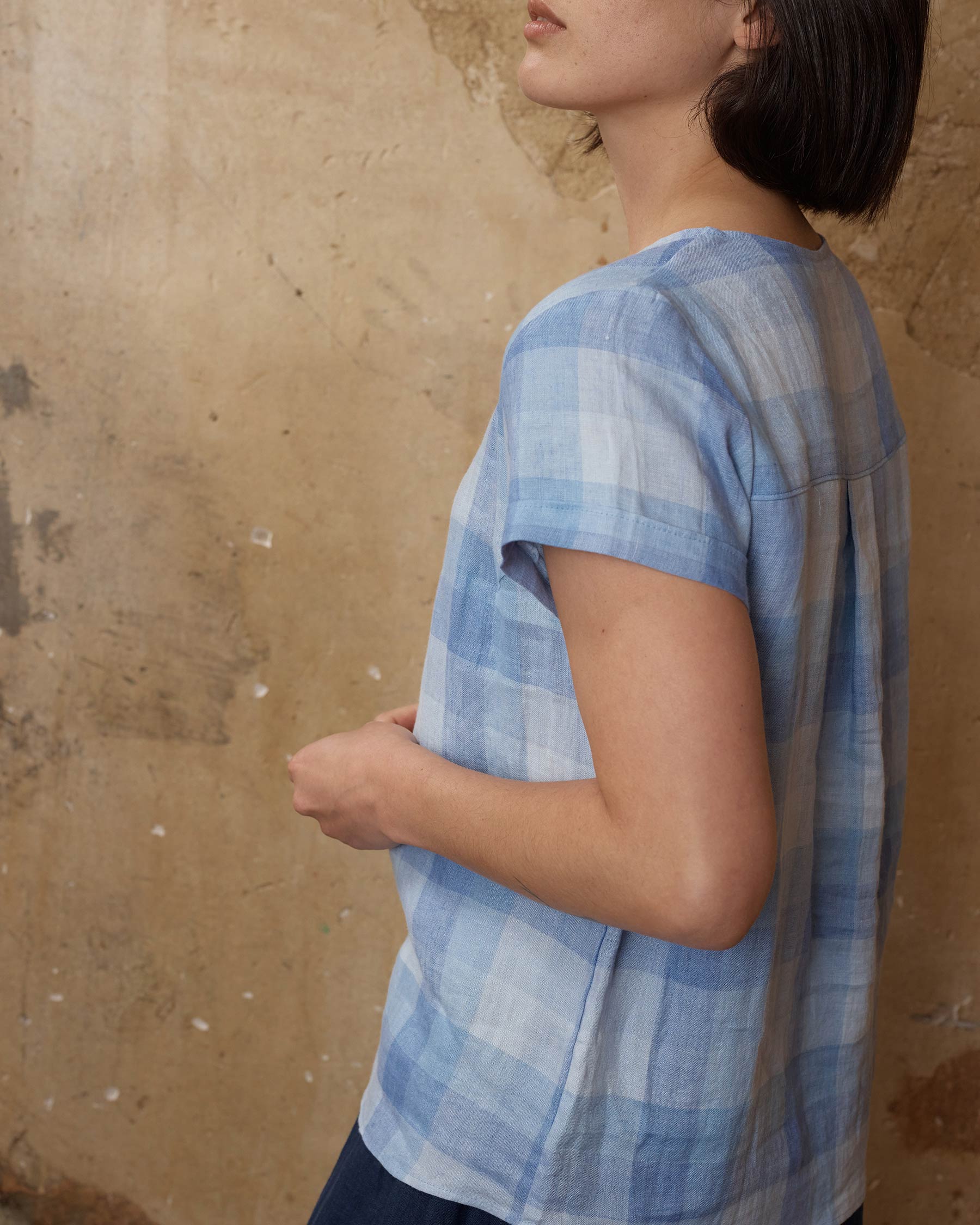 Side view of linen blouse in blue Cala Check 