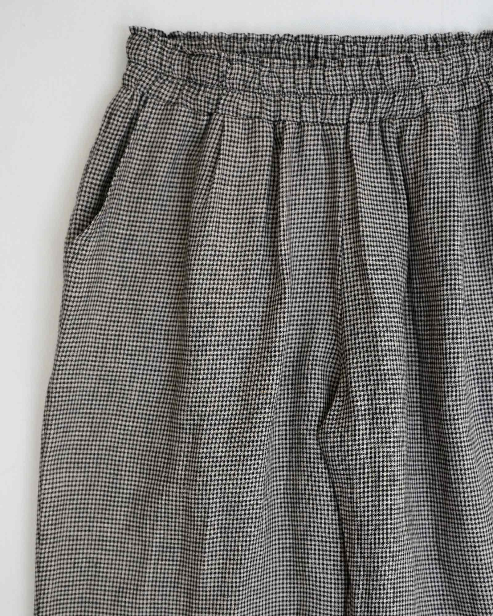 The Linen Lounge Pants No.12 in Hazlitts Check from Pyne and Smith Clothiers feature side pockets, slight pleating, an elastic waistband, and a black-and-white check pattern, crafted from sustainably grown European flax linen.