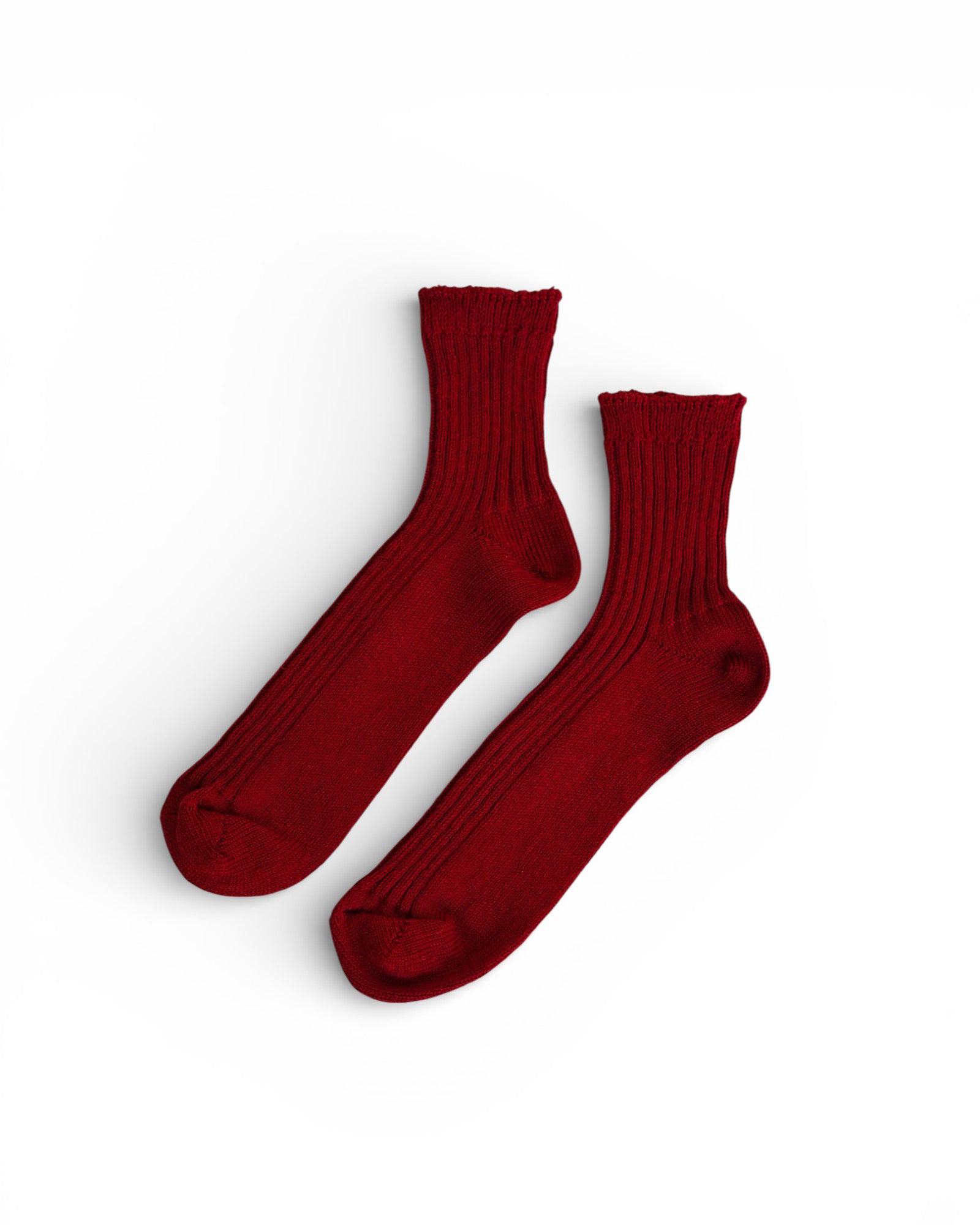 A pair of Pyne and Smith Clothiers Linen Ribbed Socks in Antique Red, laid flat on a white background.
