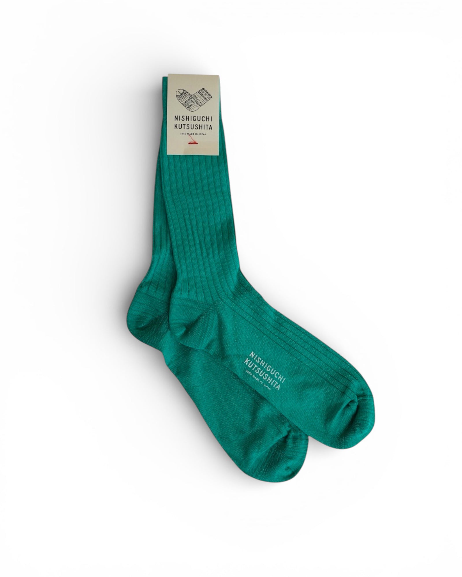 A pair of Pyne and Smith Clothiers Silk Cotton Ribbed Socks in Cast Iron Railings, neatly folded with a branded label attached at the top, made in Japan and displayed on a white background.