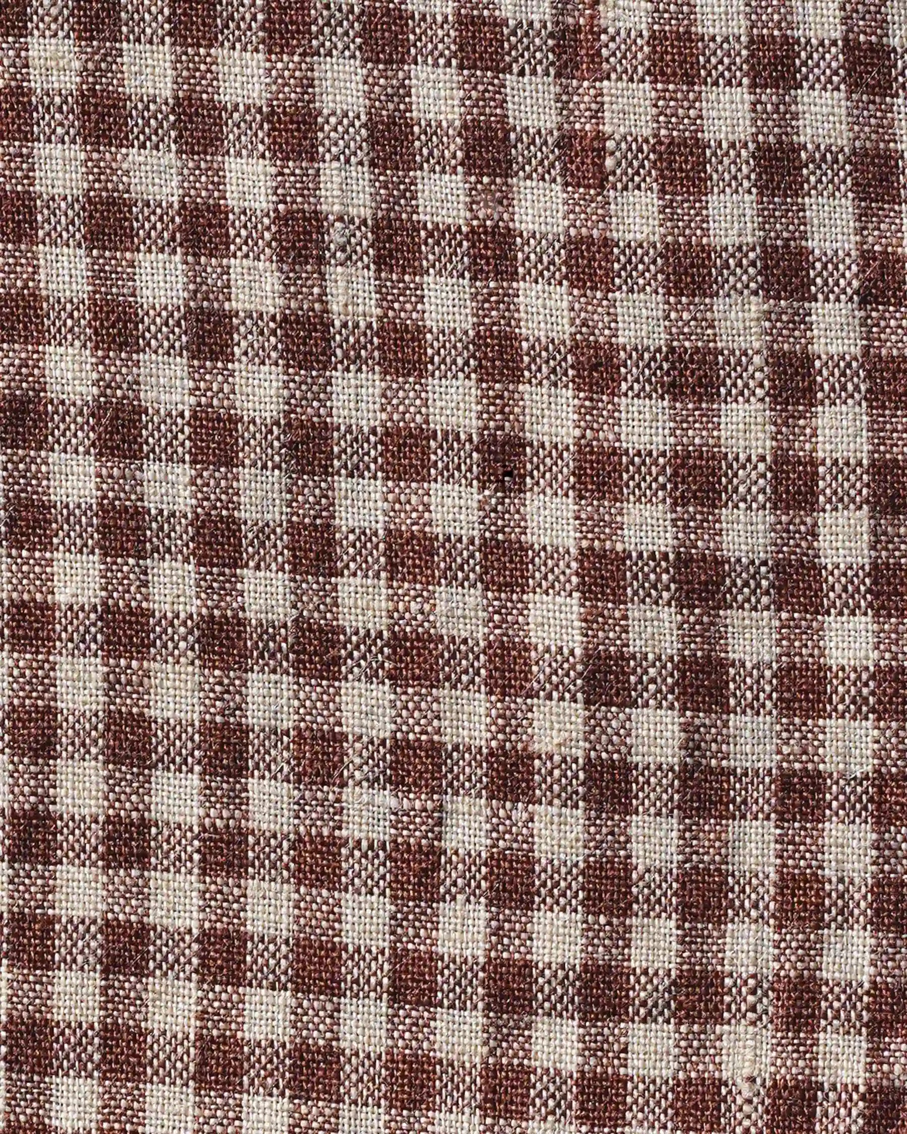 Close-up of the No.11 Classic Button Up Linen Dress in Topsham Check by Pyne and Smith Clothiers, showing woven sustainable European linen with brown and off-white checks—perfect texture for a dress with an adjustable waist tie.